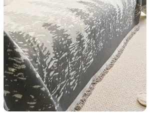Detailed close-up of Nordic gradient forest pattern knit throw blanket with fringe