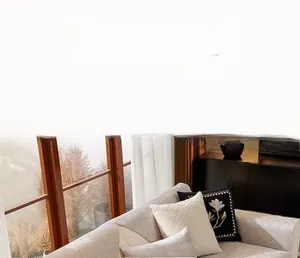Detail of grey chenille sofa cover showing elegant floral jacquard texture and cushions