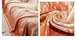 Close-up of reversible Nordic forest knit sofa throw with orange jacquard and tassels