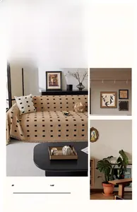 Beige plaid chenille sofa cover with fringe details and warm textured geometric pattern