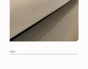 Detail of cream chenille sofa cover showing geometric diamond weave texture and fabric quality
