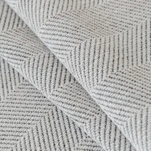 Neutral grey and white herringbone chenille sofa cover with thick woven texture