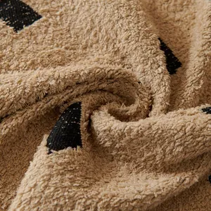 Puffy plaid sofa cover in beige chenille yarn with soft boucle texture and pattern