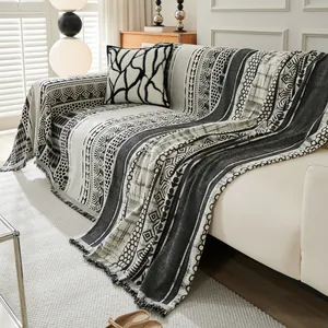 Bohemian black and white chenille sofa cover with geometric patterns and fringe