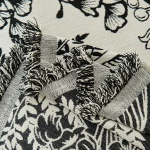 Floral chenille sofa cover with black ginkgo leaf pattern and fringe edges