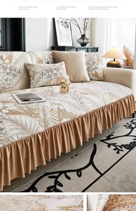 Detailed texture of chenille sofa cover with floral pattern and ruffled brown edges