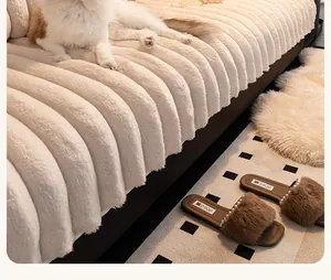 Close-up of thick cream faux rabbit fur sofa cover with decorative wide stripe texture