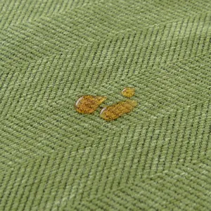 Waterproof green chenille sofa cover with classic herringbone weave texture detail