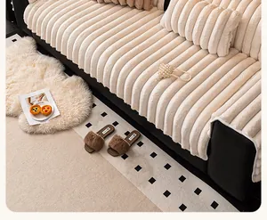 Detailed close-up of cream-colored striped plush sofa cover with soft ribbed texture