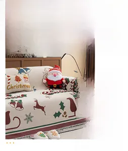 Detail of Christmas chenille sofa cover showing festive reindeer and Santa patterns