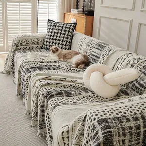 Bohemian knit sofa throw blanket with black and white geometric patterns and fringe
