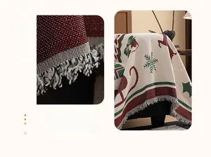 Close-up of Christmas chenille sofa cover with red reindeer patterns and fringe detail