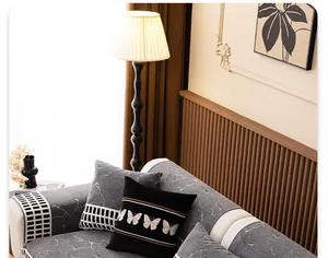 Detailed close-up of chenille sofa cover with dark marble pattern and geometric edges