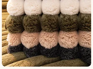 Close-up of plush colorful pom-poms on premium corduroy fabric for sofa covers