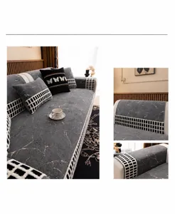 Detail des grauen Chenille Sofa-Bezugs mit Marmortextur und karierten Rändern