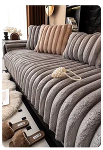 Detailed macro view of the grey faux rabbit fur sofa cover with thick vertical stripe texture