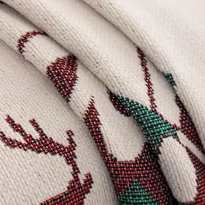 Christmas chenille sofa cover with red and green reindeer jacquard pattern on white fabric