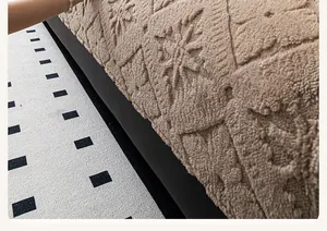 Detailed view of the thick brown fleece sofa cushion featuring textured floral patterns