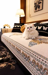 Close-up of beige chenille sofa cover with floral jacquard and butterfly embroidery pillow