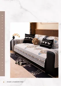 Detail of European chenille sofa cover with intricate patterns and black butterfly cushions