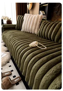 Detailed view of thick olive green plush sofa cover with vertical textured stripes