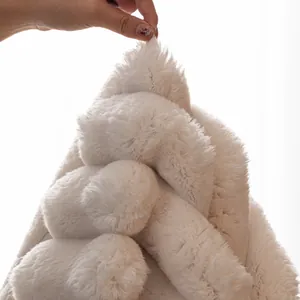 Plush white faux rabbit fur sofa cover showing soft thick texture and high density