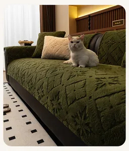Detail of dark green plush sofa cover with snowflake jacquard and diamond texture