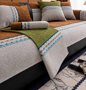 Detail of chenille sofa cushion with color-block stitching and decorative wave border