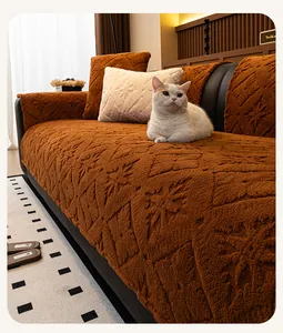 Close-up of caramel plush sofa cover with 3D snowflake texture and matching pillows