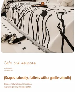 Detail of chenille sofa cover with black line pattern and fringe tassels for decor