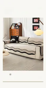 Detailed view of jacquard chenille sofa cover with black wavy edges and thick texture