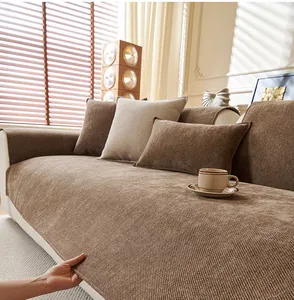 Detailed close-up of brown chenille sofa cushion with textured woven fabric and soft pillows