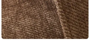 Macro detail of brown chenille sofa cushion showing striped texture and stitching