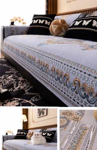Detailed texture of grey chenille sofa cover with classical floral embroidery patterns