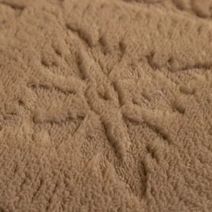 Thick coffee brown velvet sofa cover with embossed snowflake patterns for winter warmth