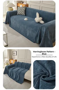Detail of blue herringbone sofa cover featuring thick chenille fabric and decorative fringes