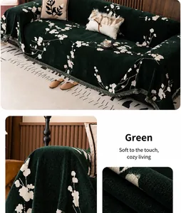 Close-up of green chenille sofa cover featuring white floral jacquard and fringe details