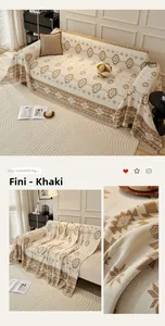 Macro detail of khaki Bohemian sofa cover with geometric patterns and fringe texture