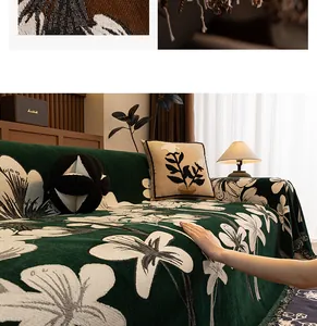 Detail of chenille sofa throw featuring beige lily patterns and fringe edges