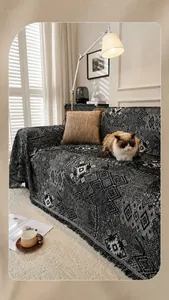 Detailed texture of Moroccan style chenille sofa cover with geometric patterns and tassels