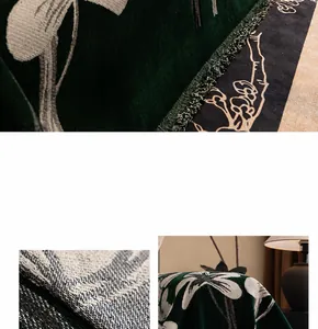 Detail of forest green chenille sofa cover featuring floral jacquard and fringe edges