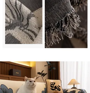 Macro shot of jacquard chenille sofa cover showing dense weave and fringed tassel details