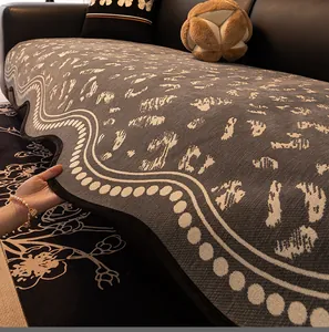 Detail of dark grey chenille sofa cover with leopard pattern and non-slip backing