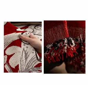 Close-up of red chenille sofa cover showing jacquard patterns and tricolor fringes
