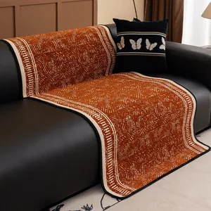 Rutschfeste Sofa-Auflage aus Chenille mit orange-beigem geometrischem Muster