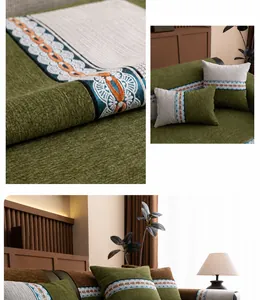 Detail of chenille sofa cover fabric with wave embroidery in moss green and orange