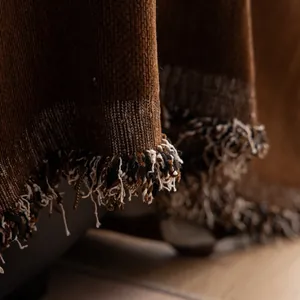 Retro luxury chenille sofa blanket in brown featuring thick ribbed texture and tassels