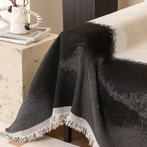 Artistic cream-style sofa cover with black-white jacquard pattern and fringes