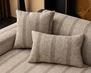 Detail of sofa cover with herringbone weave, quilting process and precise stitching