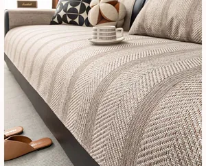 Close-up of beige herringbone weave texture on anti-slip sofa cover protector